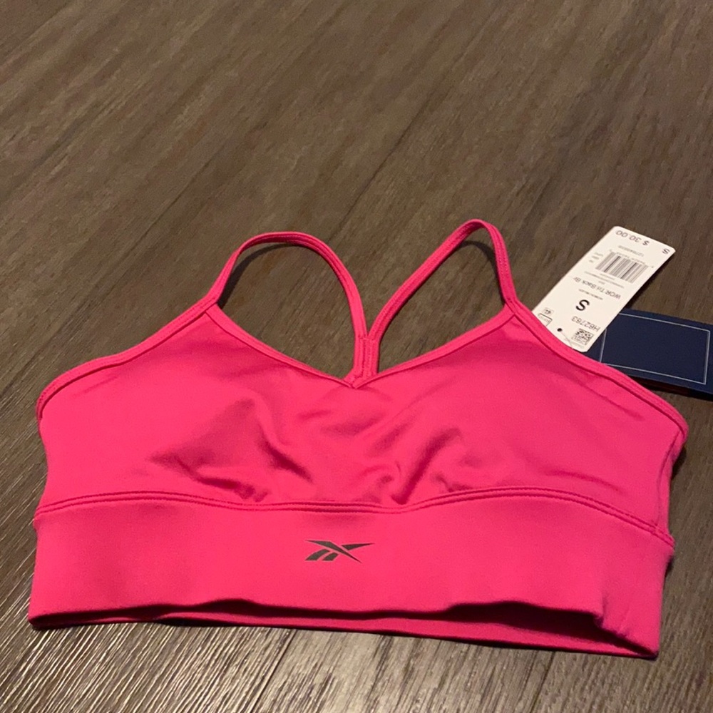 Pink medium impact Reebok sports bra in size small